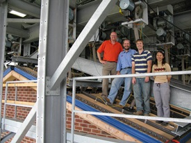 Dr. Kopp with Dr. David Henderson, Dr. Murray Morrison, and Dr. Eri Gavanski (left to right) on the roof of the ‘3 Little Pigs’ test house at IRLBH.