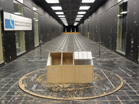 Wind tunnel model of a house with a solar array on the roof