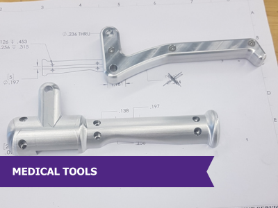 Tools for surgical procedure.  Medical engineering, CNC machining, tight tolerance, custom machining, aluminum, and prototype.