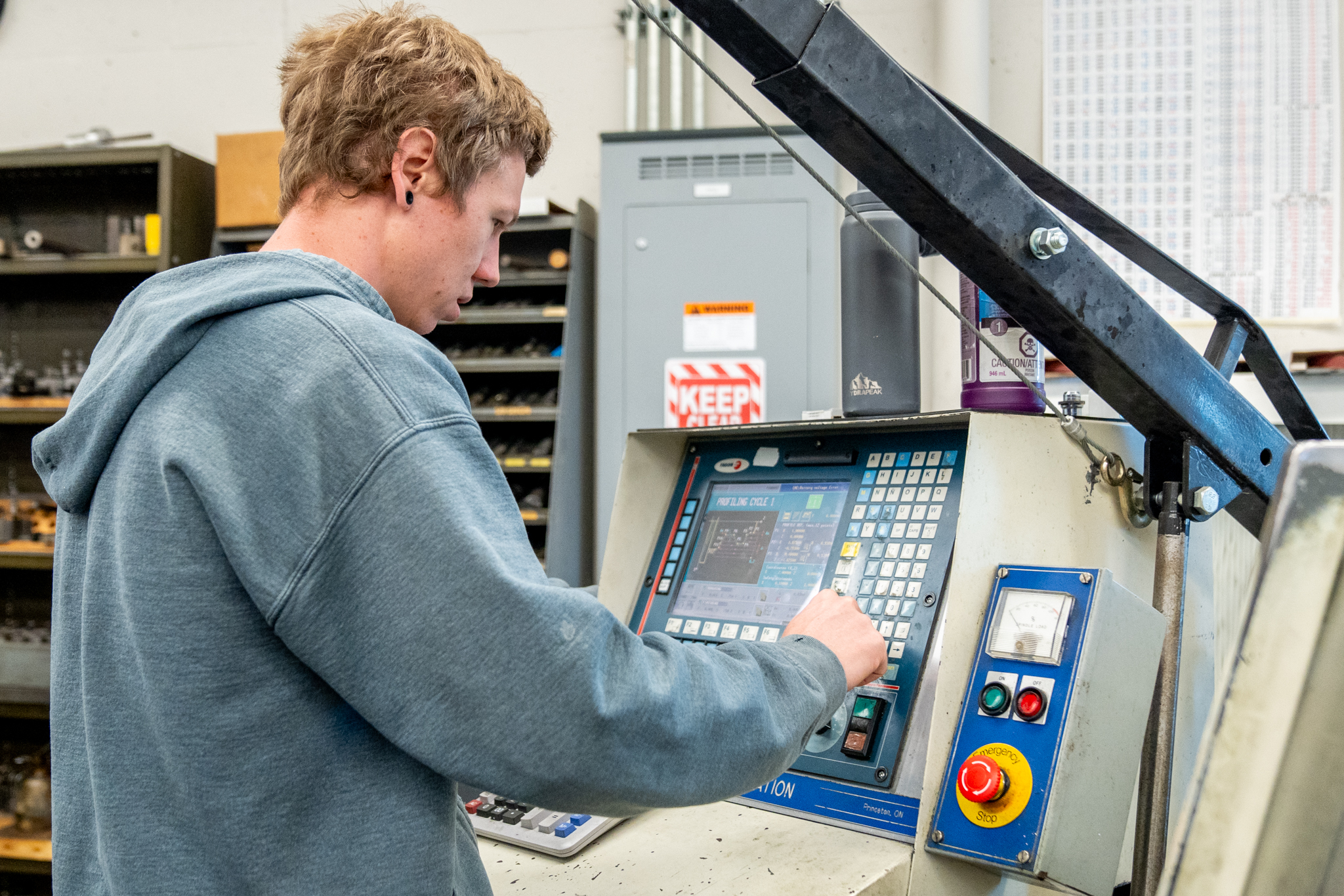 image of technician working on a CNC lathe 