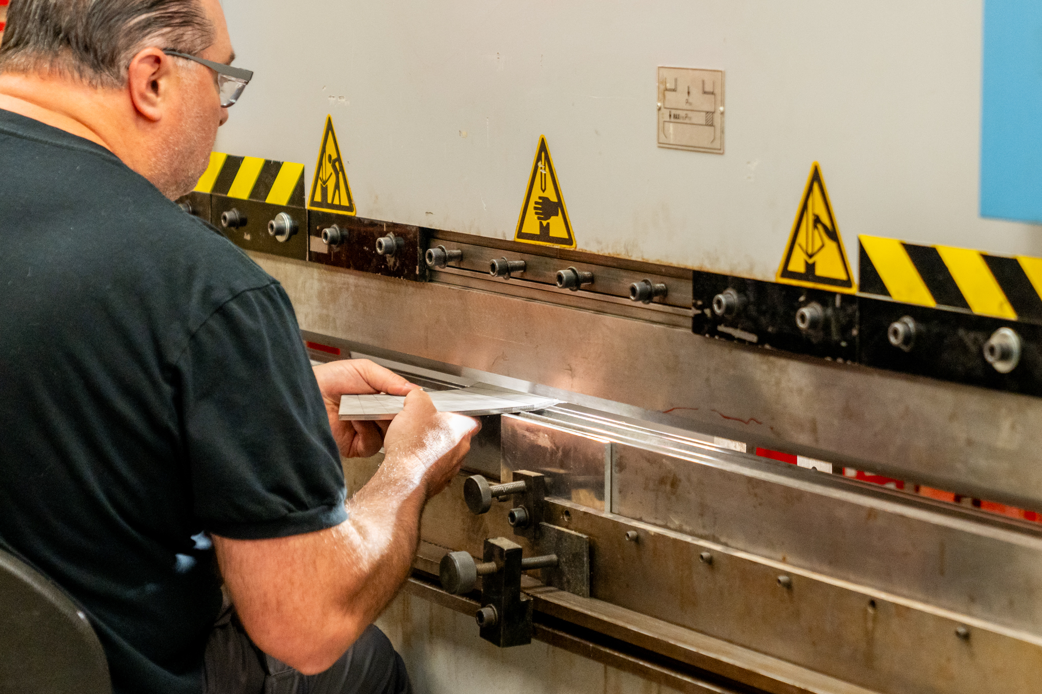 Technician working on sheet metal cutting