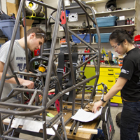 Students working on a vehicle